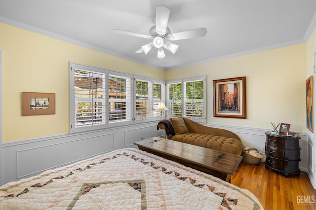 2615 22nd St, Bakersfield, CA 93301 - bedroom featuring wainscoting, ceiling fan, crown molding, and wood finished floors