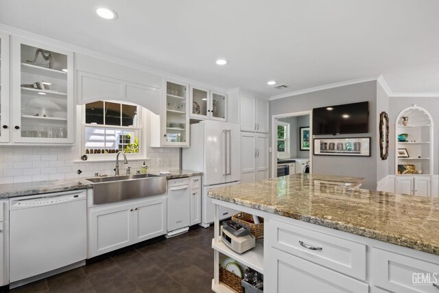 2615 22nd St, Bakersfield, CA 93301 - kitchen featuring a sink, white appliances, white cabinetry, backsplash, and ornamental molding