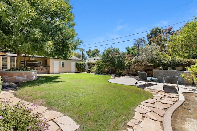 2615 22nd St, Bakersfield, CA 93301 - view of yard featuring fence, a patio area, and exterior kitchen