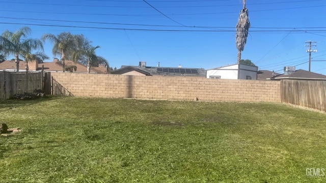 view of yard with a fenced backyard