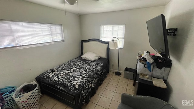 bedroom with light tile patterned floors