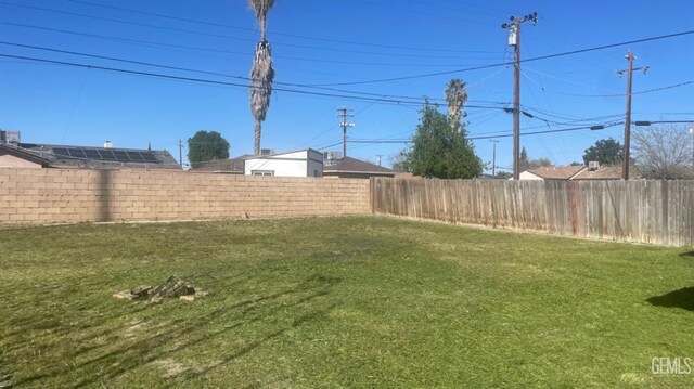 view of yard with a fenced backyard