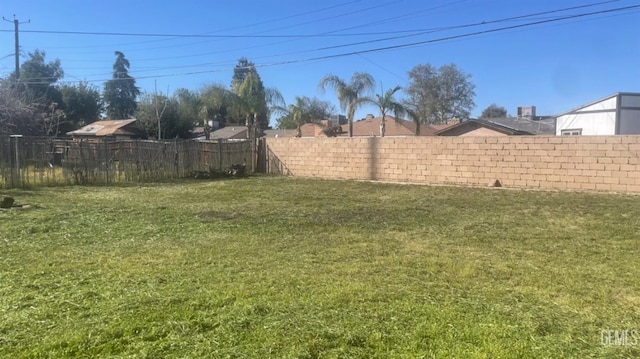 view of yard with a fenced backyard