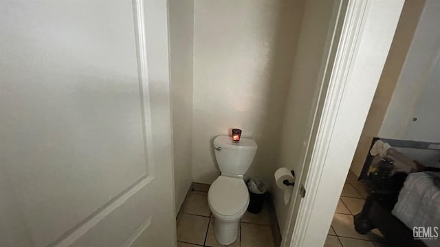 bathroom with tile patterned flooring and toilet