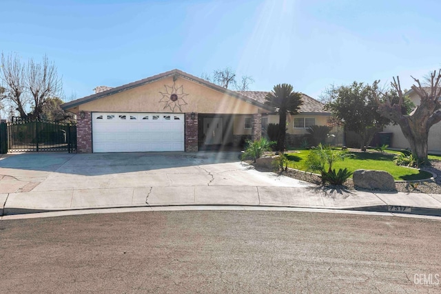 single story home featuring a front yard and a garage