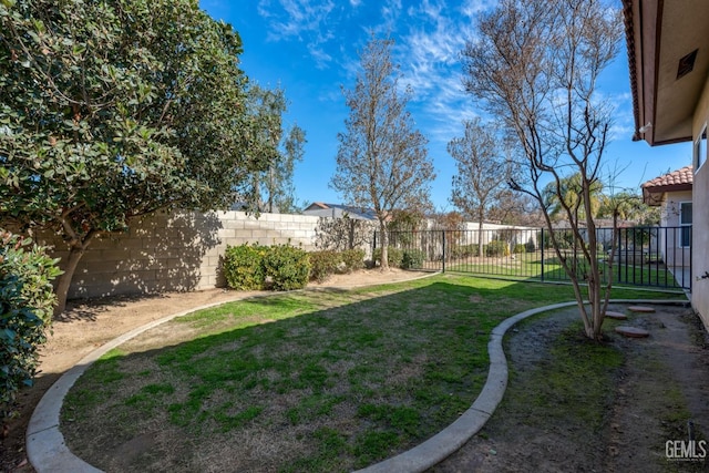 view of yard featuring a fenced backyard