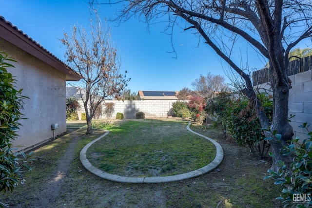 view of yard with a fenced backyard