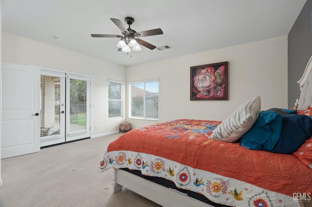 bedroom featuring ceiling fan, light colored carpet, visible vents, baseboards, and access to outside