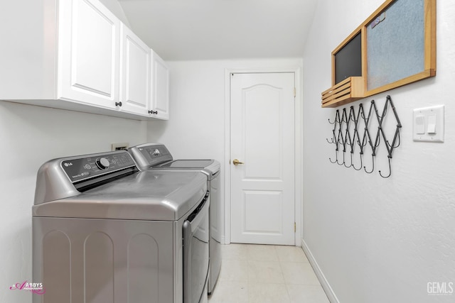 11820 Crescent Creek Ct, Bakersfield, CA 93311 - washroom featuring washer and dryer, cabinet space, and light tile patterned floors