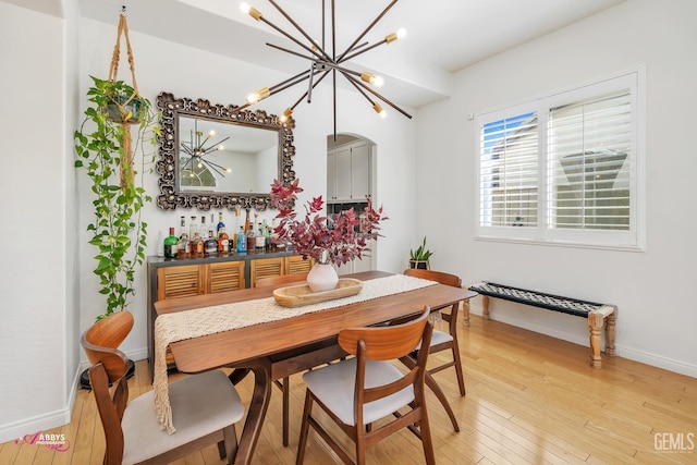 11820 Crescent Creek Ct, Bakersfield, CA 93311 - dining space featuring a chandelier and light wood-style floors