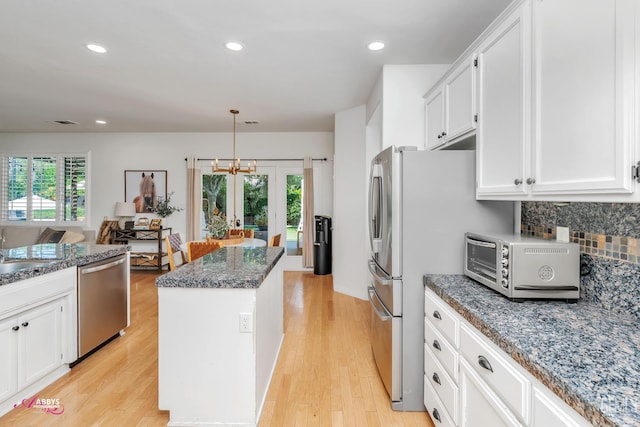 11820 Crescent Creek Ct, Bakersfield, CA 93311 - kitchen featuring stainless steel dishwasher, a center island, healthy amount of natural light, backsplash, and recessed lighting
