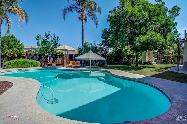 11820 Crescent Creek Ct, Bakersfield, CA 93311 - view of pool with a playground, a fenced backyard, and a patio