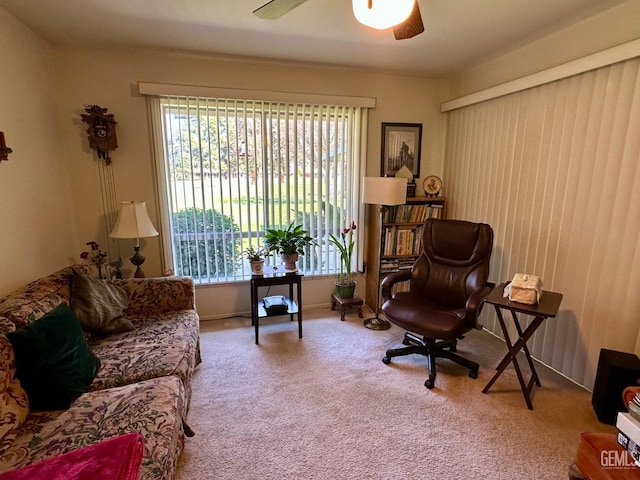 sitting room featuring ceiling fan and carpet flooring