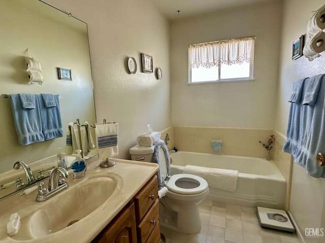 full bathroom with tile patterned floors, vanity, toilet, and a bath