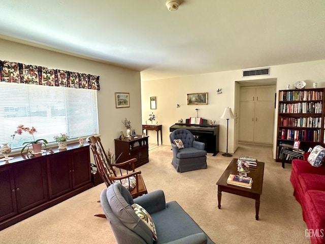 living room featuring carpet and visible vents