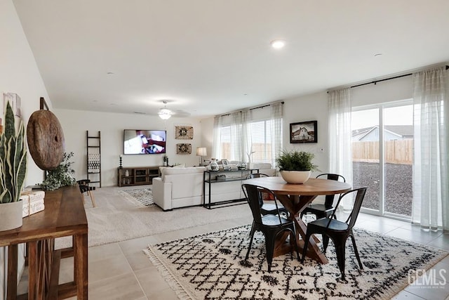 tiled dining area featuring ceiling fan