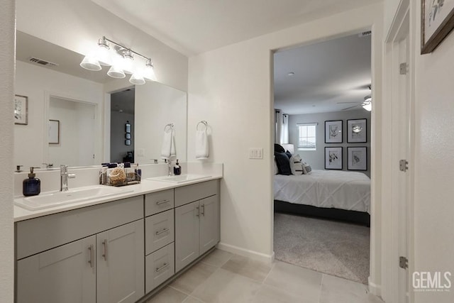 bathroom with ceiling fan, tile patterned floors, and vanity