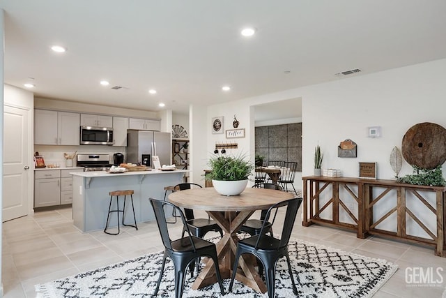 dining room featuring light tile patterned floors