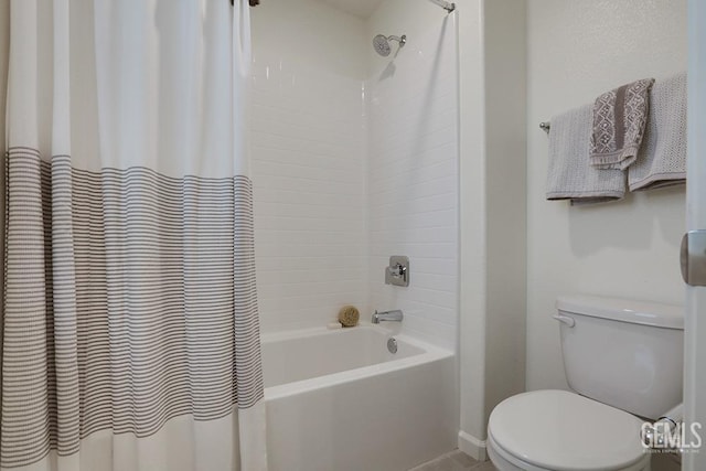 bathroom featuring toilet and shower / bath combination with curtain