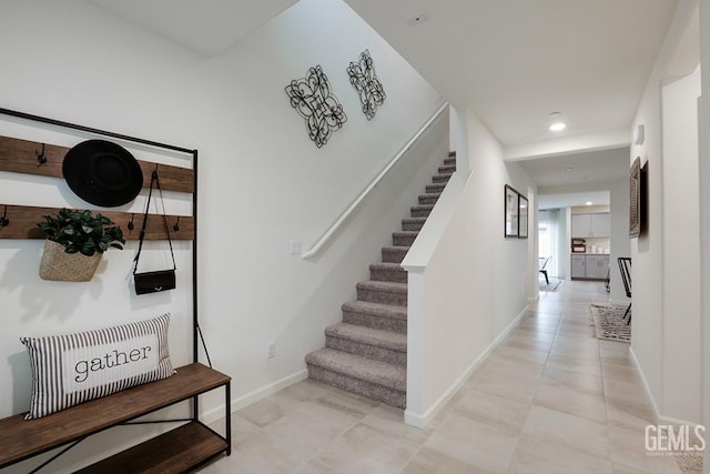 staircase with tile patterned floors