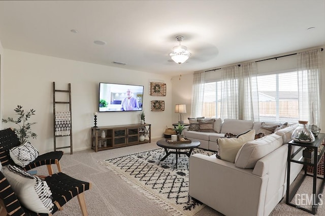 living room with light carpet and ceiling fan