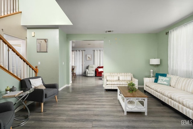 living room with dark hardwood / wood-style flooring