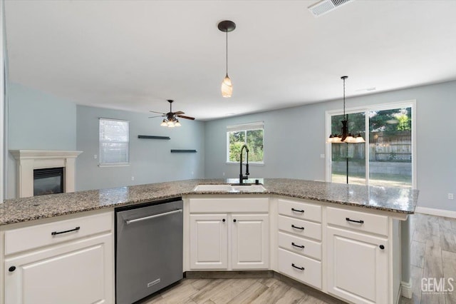 11311 Mezzadro Ave, Bakersfield, CA 93312 - kitchen featuring stainless steel dishwasher, ceiling fan, light wood-type flooring, and white cabinetry
