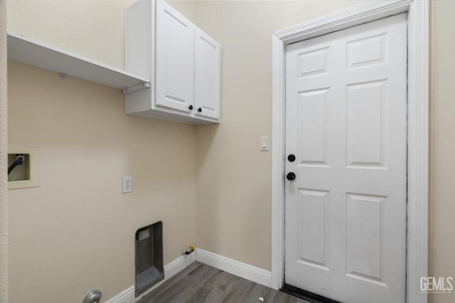 11311 Mezzadro Ave, Bakersfield, CA 93312 - laundry area with dark wood-type flooring, cabinet space, and gas dryer hookup