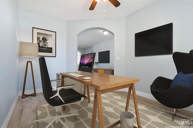 11311 Mezzadro Ave, Bakersfield, CA 93312 - home office with arched walkways, light wood finished floors, and ceiling fan