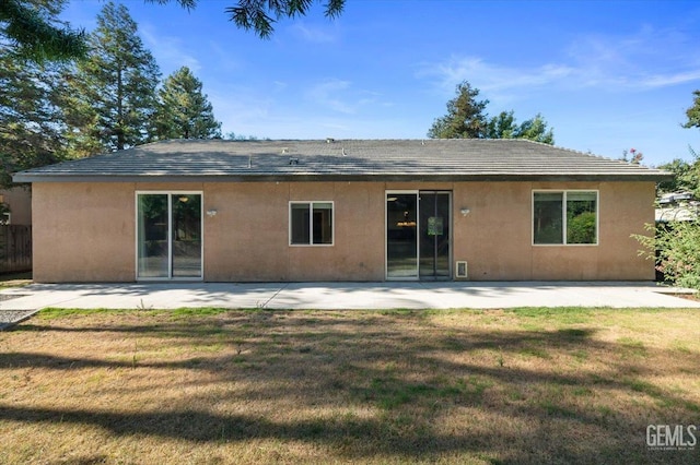 11311 Mezzadro Ave, Bakersfield, CA 93312 - back of property with a lawn, stucco siding, and a patio