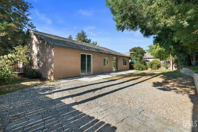 11311 Mezzadro Ave, Bakersfield, CA 93312 - rear view of house featuring stucco siding and a patio