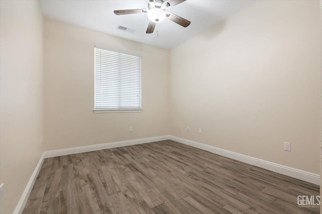 11311 Mezzadro Ave, Bakersfield, CA 93312 - spare room with a ceiling fan and wood finished floors
