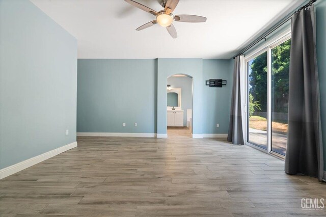11311 Mezzadro Ave, Bakersfield, CA 93312 - full bath featuring a stall shower, vanity, wood finished floors, and a garden tub
