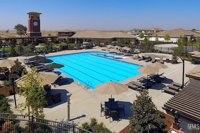 view of swimming pool featuring a patio area