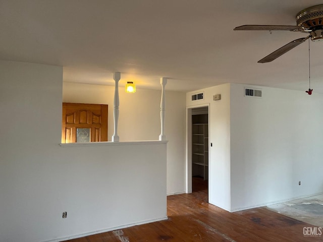 spare room with hardwood / wood-style flooring and ceiling fan