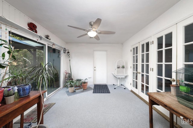 sunroom / solarium with french doors and ceiling fan