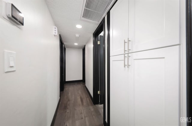 705 Stephens Dr, Bakersfield, CA 93304 - hallway featuring wood finished floors, a textured ceiling, baseboards, and recessed lighting