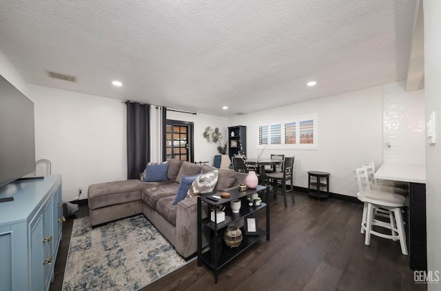 705 Stephens Dr, Bakersfield, CA 93304 - living area with dark wood-type flooring, a textured ceiling, recessed lighting, and baseboards