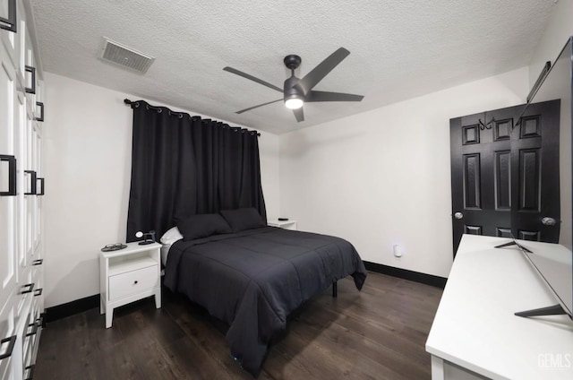 705 Stephens Dr, Bakersfield, CA 93304 - bedroom with baseboards, dark wood-style flooring, a textured ceiling, and a ceiling fan