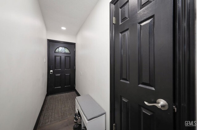 705 Stephens Dr, Bakersfield, CA 93304 - doorway to outside featuring wood finished floors, baseboards, and recessed lighting