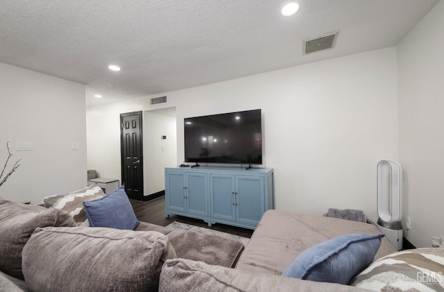 705 Stephens Dr, Bakersfield, CA 93304 - living area featuring wood finished floors, recessed lighting, and a textured ceiling