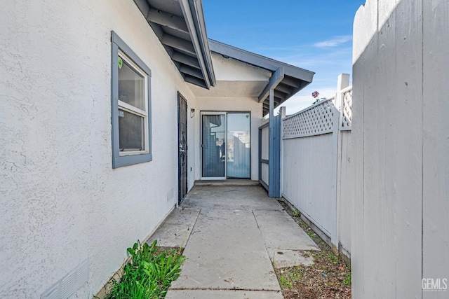 doorway to property with a patio area