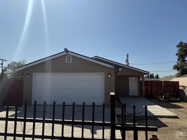 ranch-style home with a garage