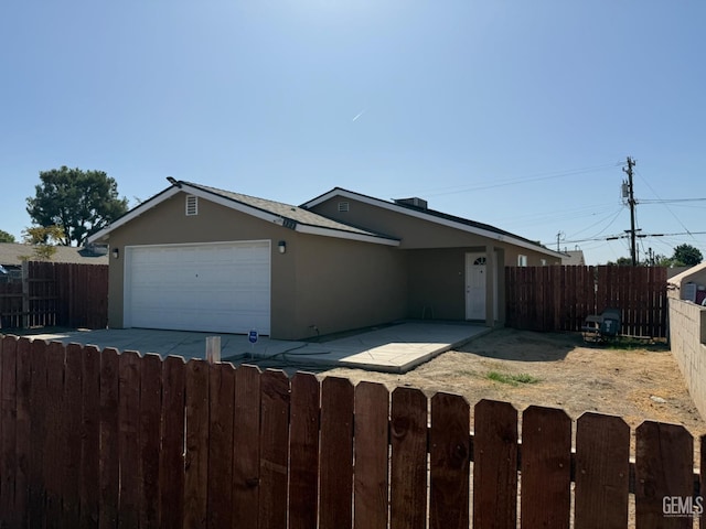 single story home featuring a garage