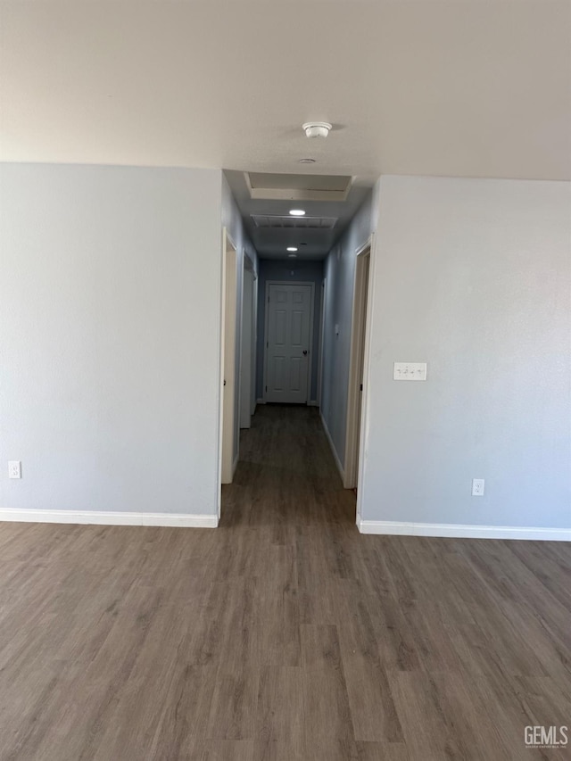 corridor featuring dark hardwood / wood-style flooring