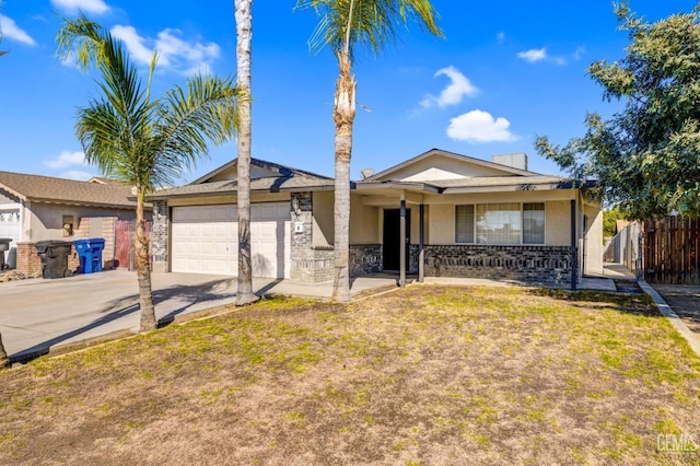 ranch-style home featuring a front lawn and a garage