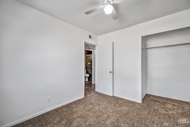 unfurnished bedroom featuring carpet flooring, a textured ceiling, a closet, and ceiling fan