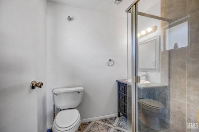 bathroom with toilet, walk in shower, and sink