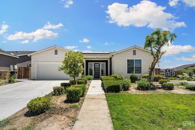 6622 Sycamore Wood Ln, Bakersfield, CA 93313 - single story home featuring an attached garage, solar panels, concrete driveway, french doors, and stone siding