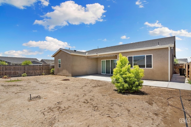 6622 Sycamore Wood Ln, Bakersfield, CA 93313 - rear view of property with stucco siding, a fenced backyard, and a patio